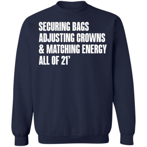 Securing bags adjusting crowns and matching energy all of 21′ shirt